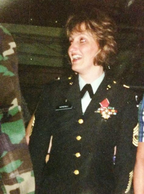 Grace Kendall smiles while wearing her military regalia